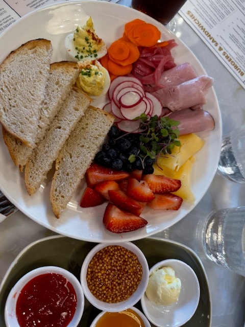 Breakfast platter with cured meats and toast